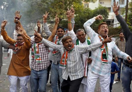 Supporters of Congress party celebrate after learning of initial results outside the party office in Ahmedabad, November 8, 2015. REUTERS/Amit Dave