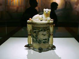 A recumbent lion, identified as Tutankhamun, rests atop a cosmetic jar that once contained a mixture of plant and animal fats.