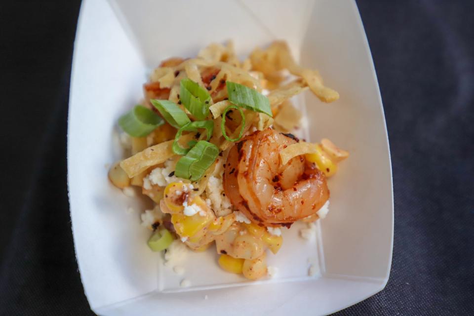 A shrimp dish with Mexican garnishes is served at the Grey Ghost Detroit booth, during the Detroit Free Press Food and Wine Experience in Capital Park in downtown Detroit on Saturday, Sept. 14, 2019. 