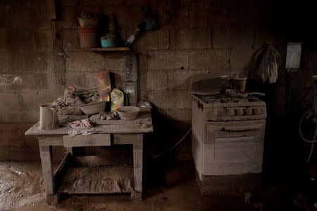 A kitchen of a house is covered in ash after the eruption of the Fuego volcano at San Miguel Los Lotes in Escuintla, Guatemala, June 8, 2018. REUTERS/Carlos Jasso