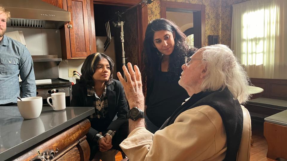 Aditi Paudel (left, seated) and Bruce Dern filming on location for "The World's Happiest Man"