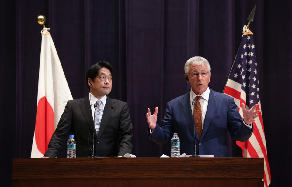 U.S. Secretary of Defense Chuck Hagel and Japanese Defense Minister Itsunori Onodera participate in a joint news conference at the Japanese Ministry of Defense headquarters Sunday April 6, 2014 in Tokyo, Japan. Secretary Hagel announced that the U.S. is planning to forward-deploy two additional AEGIS ballistic missile defense ships to Japan by 2017. (AP Photo/Alex Wong/POOL)