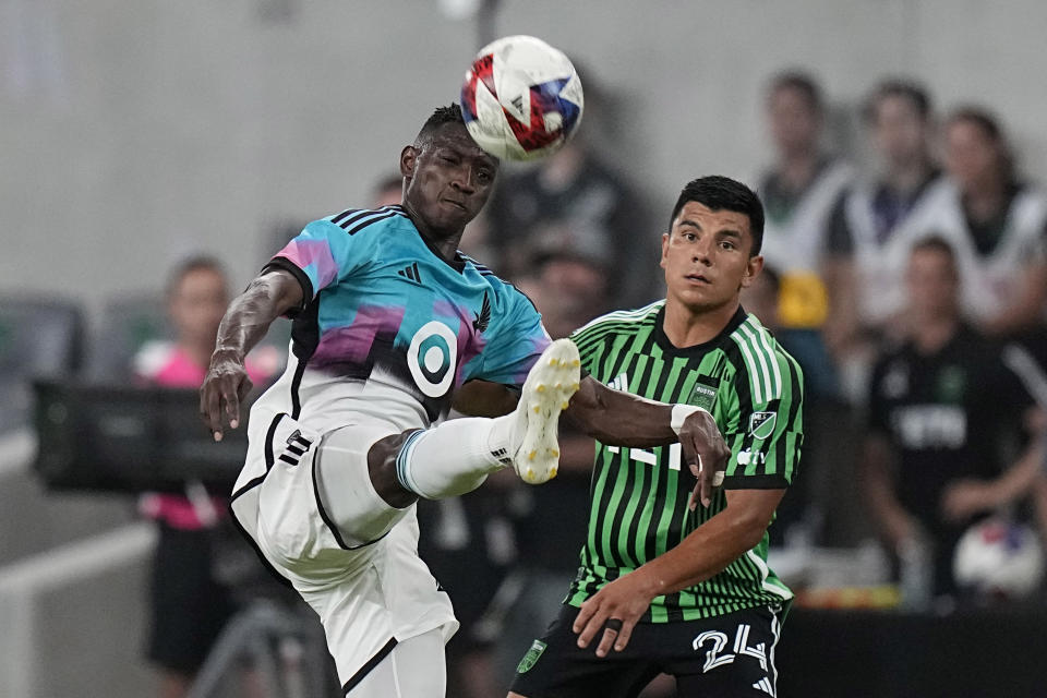 Minnesota United forward Mender García kicks the ball next to Austin FC defender Nick Lima (24) during the second half of an MLS soccer match Wednesday, May 31, 2023, in Austin, Texas. (AP Photo/Eric Gay)