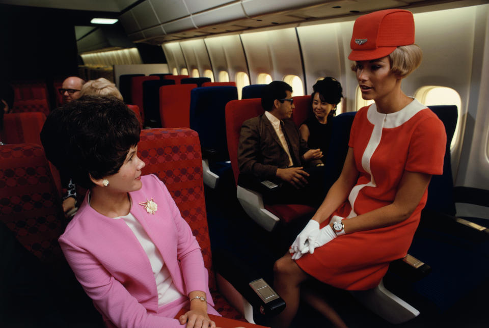 A United Airlines flight attendant in a simulated passenger compartment of a Douglas DC-10 in&nbsp;1968.