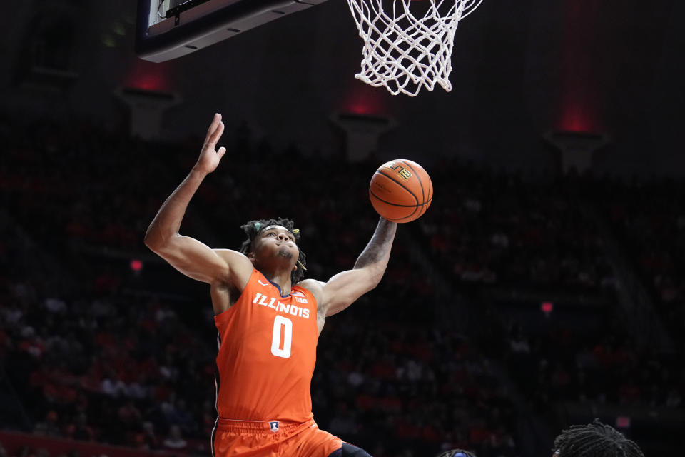 Illinois' Terrence Shannon Jr. goes up for a dunk during the first half of the team's NCAA college basketball game against Marquette on Tuesday, Nov. 14, 2023, in Champaign, Ill. (AP Photo/Charles Rex Arbogast)