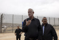 Israeli Defense Minister Benny Gantz, center, attends a ceremony marking the completion oof an enhanced security barrier along the Israel-Gaza border, Tuesday, Dec. 7, 2021. Israel has announced the completion of the enhanced security barrier around the Gaza Strip designed to prevent militants from sneaking into the country. (AP Photo/Tsafrir Abayov)