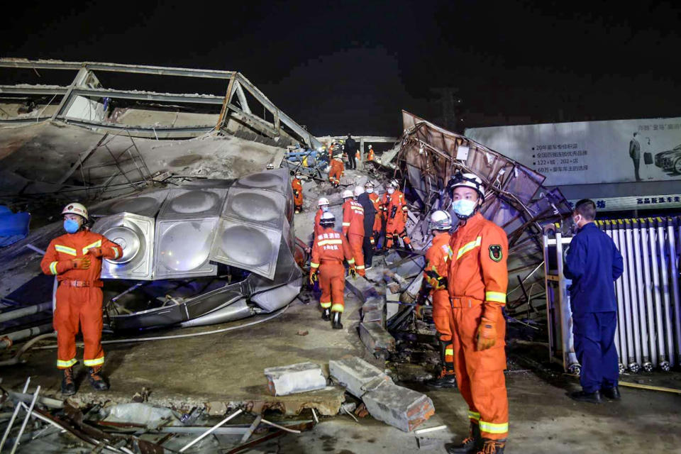 Rescuers work in the rubble of a collapsed hotel in Quanzhou, in China's eastern Fujian province on March 7, 2020. - Around 70 people were trapped after the Xinjia Hotel collapsed on March 7 evening, officials said. (Photo by STR / AFP) / China OUT (Photo by STR/AFP via Getty Images)