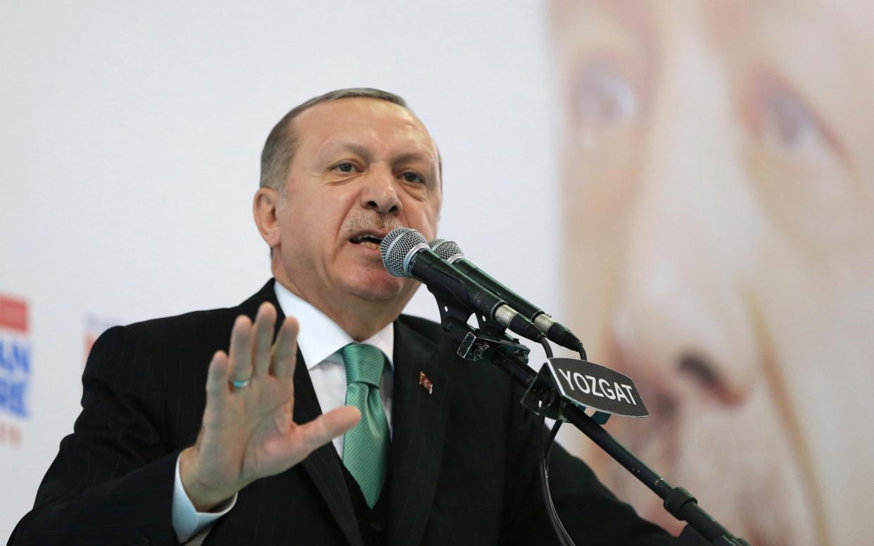 President Recep Tayyip Erdogan talks to supporters of his ruling Justice and Development Party (AKP), at a rally in Yozgat, eastern Turkey, Sunday, - Presidency Press Service