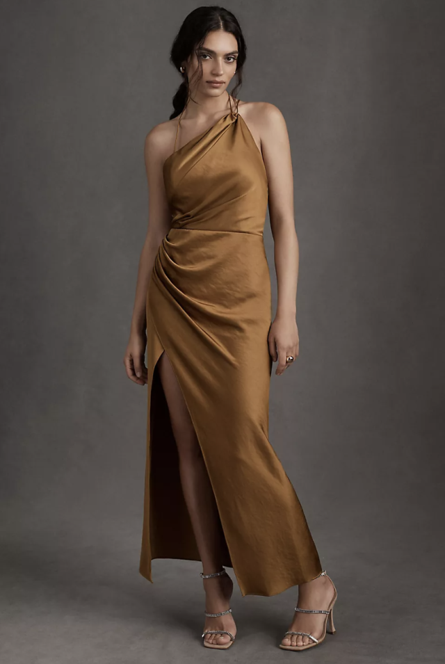 brunette model wearing gold brown one shoulder gown, Significant Other Satin Gracie Dress (Photo via Anthropologie)