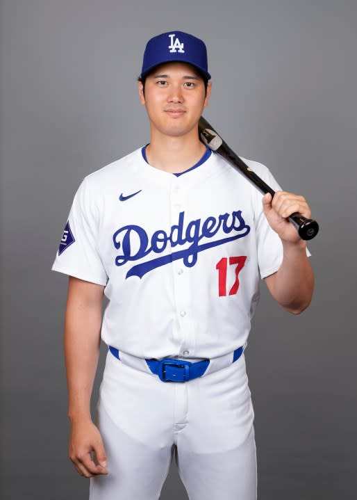 Los Angeles Dodgers designated hitter Shohei Ohtani poses for a photo during a spring training baseball photo day on Wednesday, Feb. 21, 2024, in Phoenix. (AP Photo/Ashley Landis)