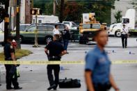 Law enforcement officers mark evidence near the site where Ahmad Khan Rahami, sought in connection with a bombing in New York, was taken into custody in Linden, New Jersey, U.S., September 19, 2016. REUTERS/Eduardo Munoz