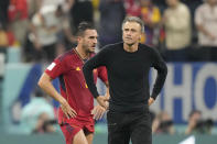 Spain's Koke and head coach Luis Enrique react at the end of the World Cup group E soccer match between Spain and Germany, at the Al Bayt Stadium in Al Khor , Qatar, Sunday, Nov. 27, 2022. The match ended in a 1-1 draw. (AP Photo/Matthias Schrader)