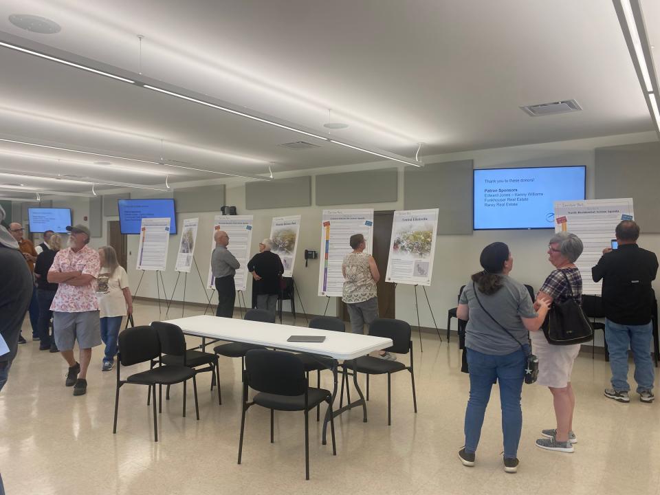 Many community members attended a celebration Tuesday evening at the Ellettsville Town Hall to read about the planned initiatives for their town's future.