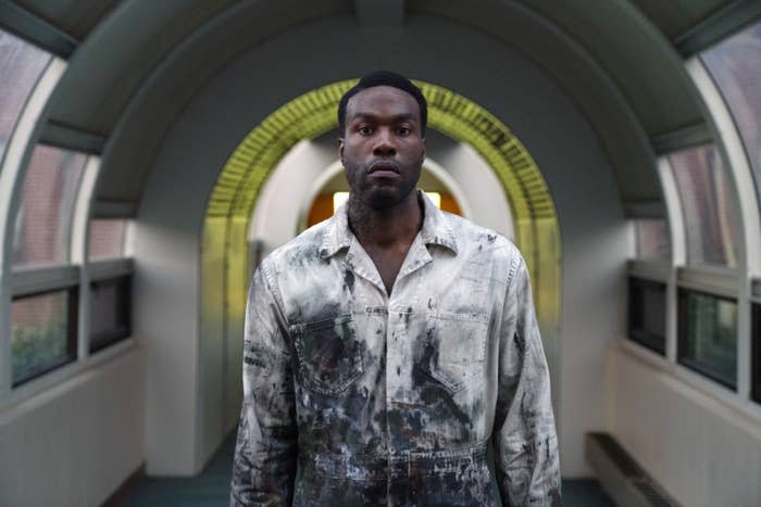 Yahya Abdul-Mateen II in paint-splattered coveralls