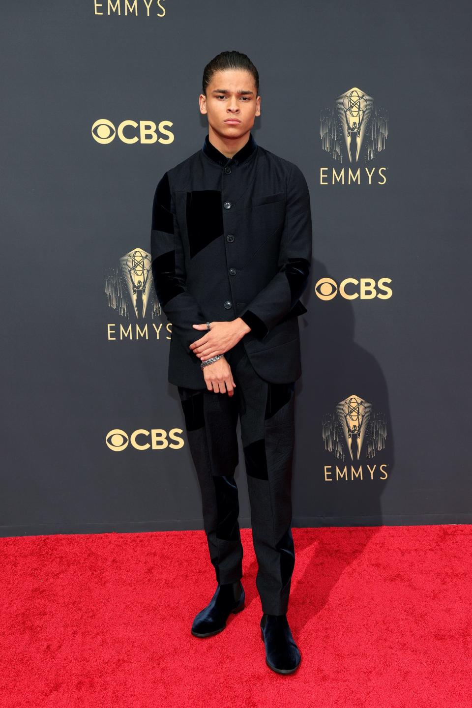 D'Pharaoh Woon-A-Tai wears a black shirt and top on the Emmys red carpet.