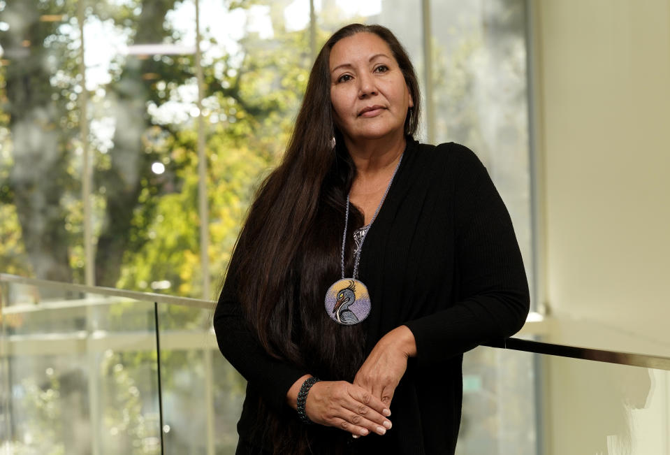 FILE - Michelle Beaudin, council member for the Lac Courte Oreilles Tribe in Wisconsin, poses for a photo at the National Congress of American Indians' 79th Annual Convention and Market Place in Sacramento Calif., Nov. 3, 2022. Beaudin, who has been a foster care parent and adopted her now adult daughter who is Ojibwe and Ho-Chunk, supports the 1978 Indian Child Welfare Act as a way to preserve Native American culture and traditions. The Supreme Court on Thursday, June 15, 2023, preserved the 1978 Indian Child Welfare Act, which gives preference to Native American families in foster care and adoption proceedings of Native children. (AP Photo/Rich Pedroncelli, File)