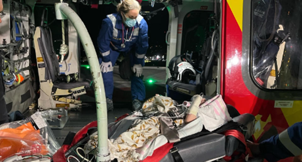 Hugo being loaded onto the Westpac helicopter. 