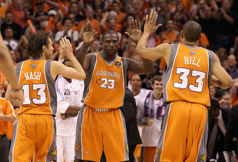 Jason Richardson #23 of the Phoenix Suns high-fives teammates Steve Nash #13 and Grant Hill #33 after scoring against the San Antonio Spurs on May 5, 2010 in Phoenix, Ariz.<span class="copyright">Christian Petersen—Getty Images</span>