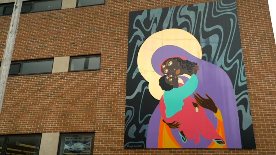 "Black Freedom, Black Madonna & the Black Child of Hope" by Raphaella "Raph" Brice decorates the east side of the Fletcher Free Library
