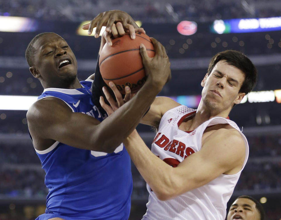 Kentucky forward Julius Randle, left, fights for a rebound with Wisconsin forward Duje Dukan during the second half of an NCAA Final Four tournament college basketball semifinal game Saturday, April 5, 2014, in Arlington, Texas. (AP Photo/David J. Phillip)