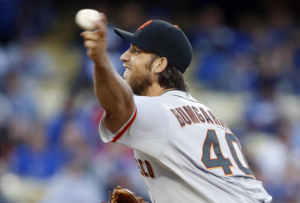 San Francisco Giants starting pitcher Madison Bumgarner delivers against the Los Angeles Dodgers during the first inning of a baseball game, Friday, May 9, 2014, in Los Angeles. (AP Photo/Danny Moloshok)