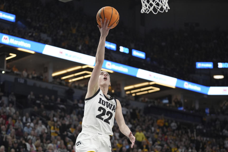 Iowa guard Caitlin Clark (22) shoots during the second half of an NCAA college basketball game against Michigan in the semifinals of the Big Ten women's tournament Saturday, March 9, 2024, in Minneapolis. (AP Photo/Abbie Parr)