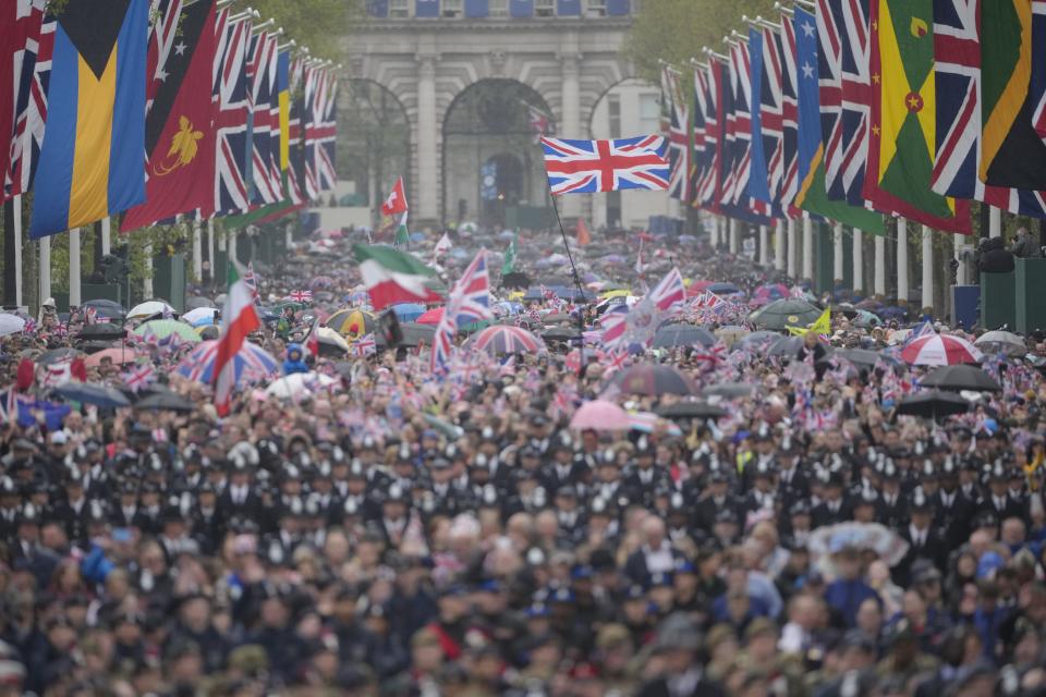 Crowds are on the way to Buckingham Palace after the coronation ceremony for Britain’s King Charles III in London.