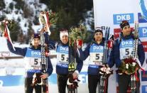 Biathlon - IBU World Championships - Men 4 x 7.5 km Relay - Hochfilzen, Austria - 18/2/17 - Jean Guillaume Beatrix of France, Quentin Fillon Maillet of France, Simon Desthieux of France and Martin Fourcade of France on the podium. REUTERS/Leonhard Foeger