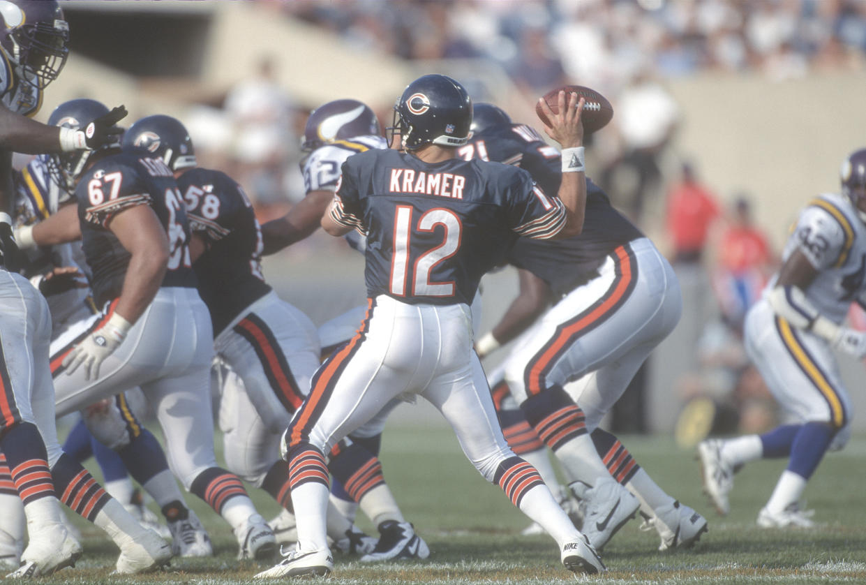 CHICAGO, IL - SEPTEMBER 3:  Erik Kramer #12 of the Chicago Bears throws a pass against the Minnesota Vikings during an NFL football game on September 3, 1995 at Soldier Field in Chicago, Illinois. Kramer played for the Bears from 1994-1998. (Photo by Focus on Sport/Getty Images)