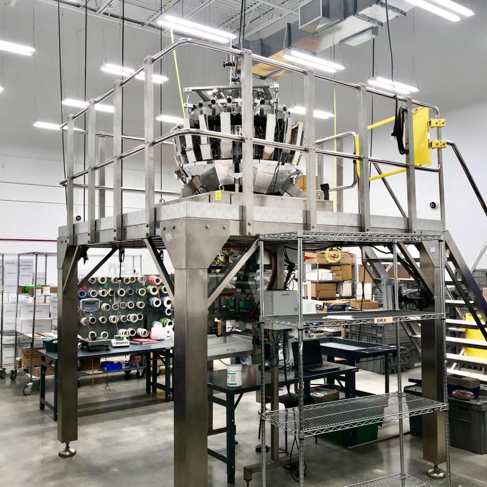 A "bud sorting" machine at Cresco Labs in Joliet, Illinois on May 22, 2019. The sorter is designed to weigh and package dried marijuana flower. Photo credit: Alexis Keenan/Yahoo Finance