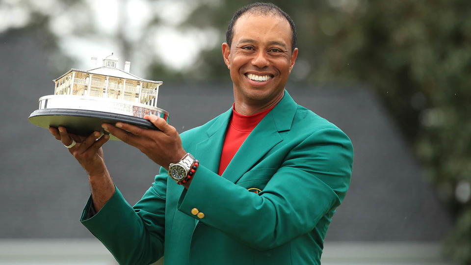 Tiger Woods celebrates with the Masters Trophy. (Photo by Andrew Redington/Getty Images)