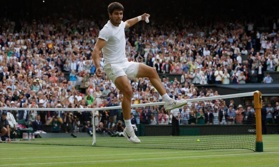 Carlos Alcaraz kicks a ball into the crowd after beating Novak Djokovic