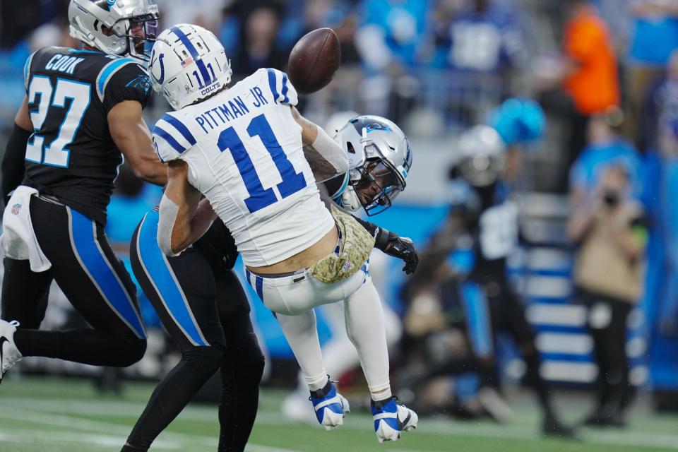 Carolina Panthers safety Xavier Woods breaks up a pass intended for Indianapolis Colts wide receiver Michael Pittman Jr. during the first half of an NFL football game Sunday, Nov. 5, 2023, in Charlotte, N.C. (AP Photo/Rusty Jones)
