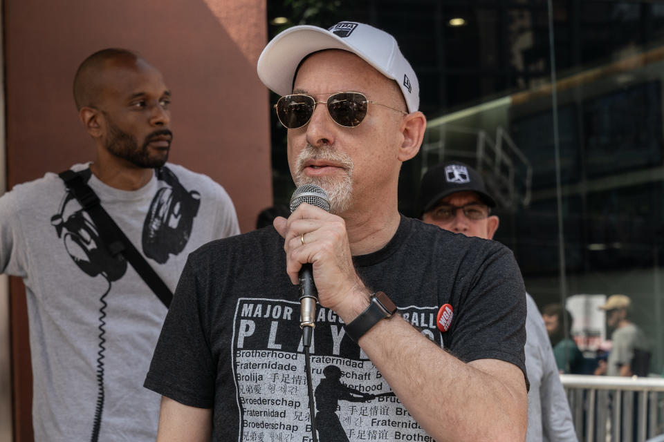 NEW YORK, UNITED STATES - 2023/07/26: Deputy Executive Director at Major League Baseball Players Association Bruce Meyer speaks as striking members of Writers Guild of America picketing in front of CBS Broadcast Center on theme Sport Writers Picket. Executives from NHL Players Association, NFL Players Association, MLB Players Association joined and spoke during picket. (Photo by Lev Radin/Pacific Press/LightRocket via Getty Images)