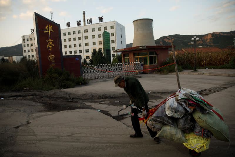 The Wider Image: Energy security and economic fears drive China's return to coal