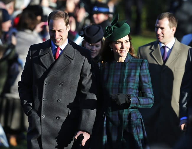 Britain's Prince William, left, accompanied by his wife Kate, Duchess of Cambridge, arrive to attend a Christmas Day Service with other members of the royal family at St. Mary's church on the grounds of Sandringham Estate, the Queen's retreat, in Norfolk, England, Wednesday, Dec. 25, 2013. (AP Photo/Lefteris Pitarakis)