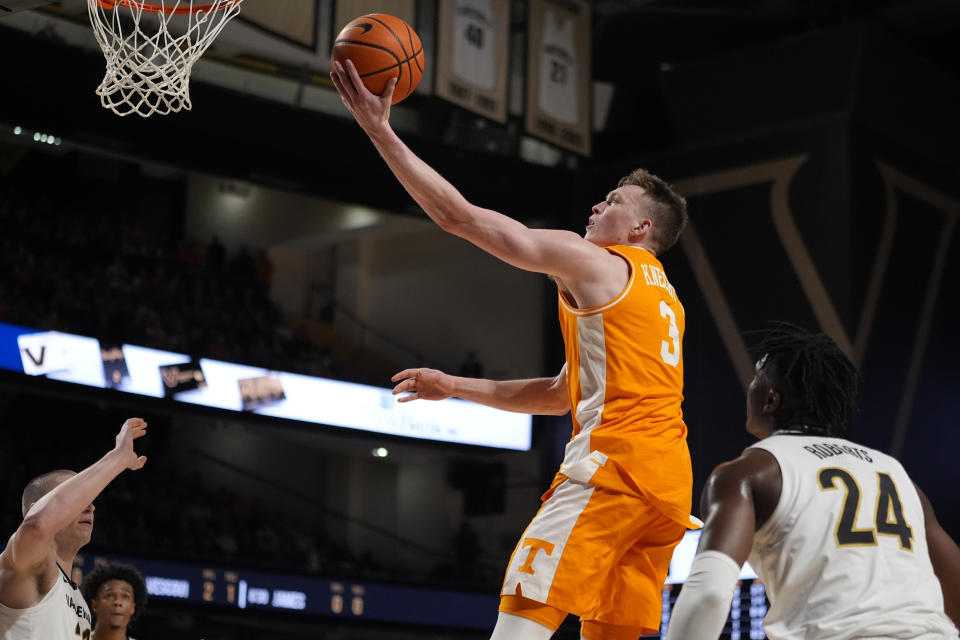 Tennessee guard Dalton Knecht (3) shoots past Vanderbilt defenders during the first half of an NCAA college basketball game Saturday, Jan. 27, 2024, in Nashville, Tenn. (AP Photo/George Walker IV)