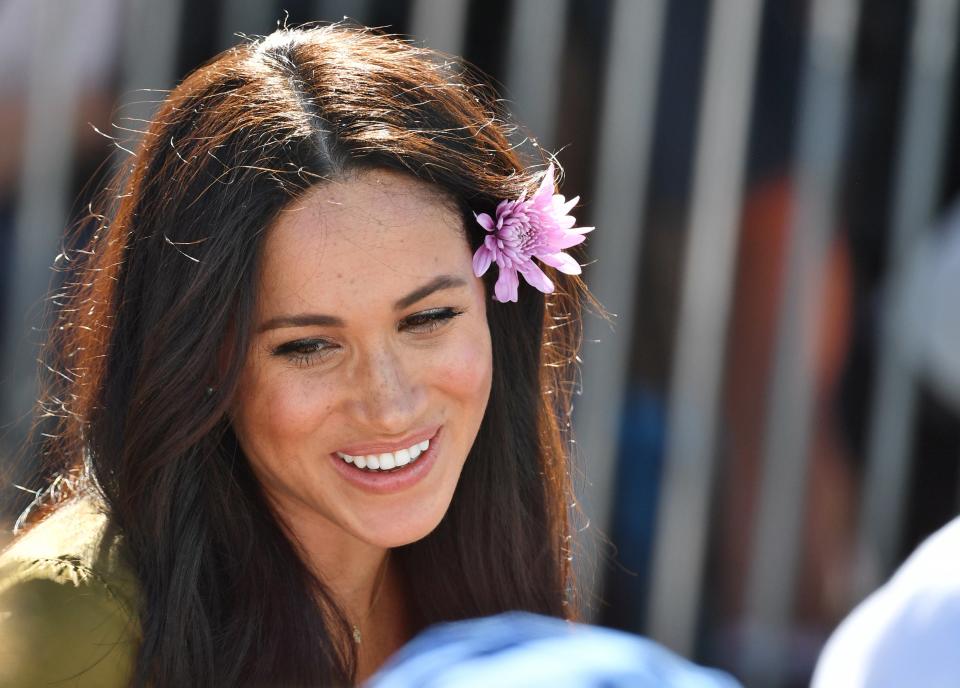 The Duchess of Sussex tucked a flower behind her ear while walking around the Bo Kaap area of Cape Town. “The princess was very pretty,” said Sancuna Ngomiyaphi, 7.