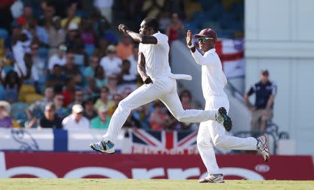 Cricket - West Indies v England - Third Test - Kensington Oval, Barbados - 2/5/15 West Indies' Jerome Taylor celebrates taking the wicket of England's Ian Bell Action Images via Reuters / Jason O'Brien