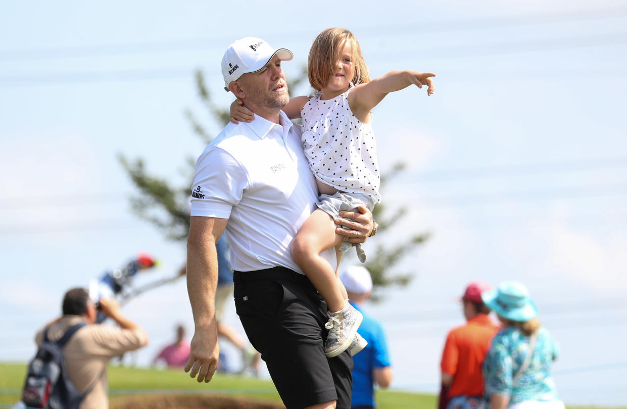 Mike Tindall walks off the 4th tee with his daughter Mia after teeing off during the Celebrity Cup charity fundraiser golf tournament at the Celtic Manor Resort in Newport, Gwent. (Photo by Andrew Matthews/PA Images via Getty Images)