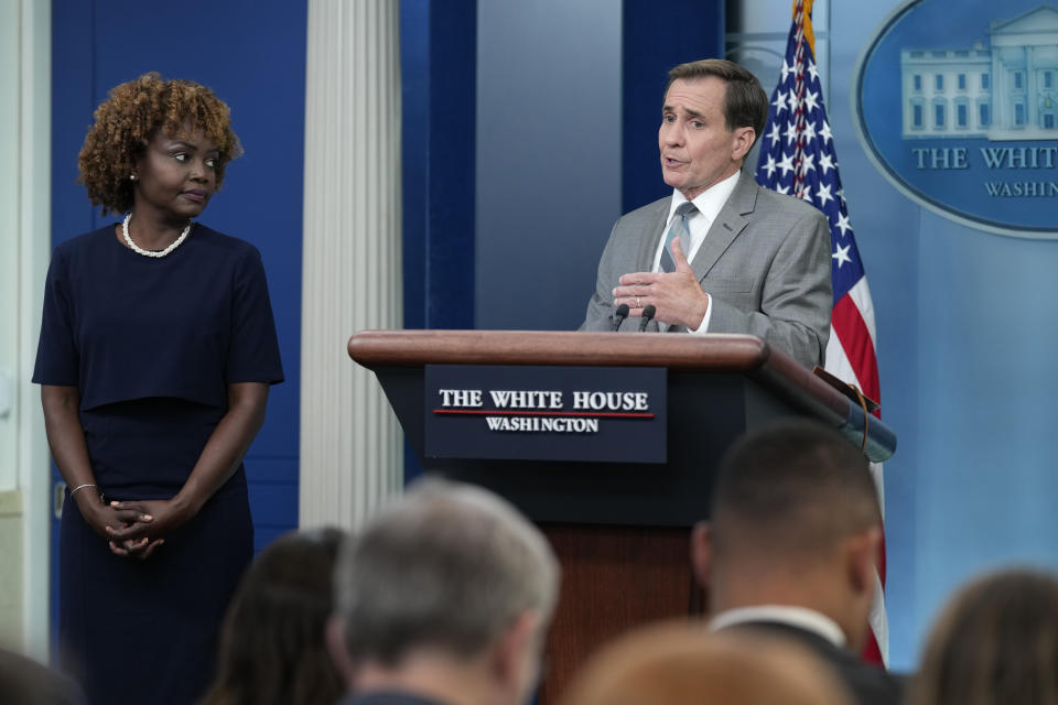 White House press secretary Karine Jean-Pierre, left, listens as National Security Council spokesman John Kirby speaks during the daily briefing at the White House in Washington, Monday, July 17, 2023. (AP Photo/Susan Walsh)