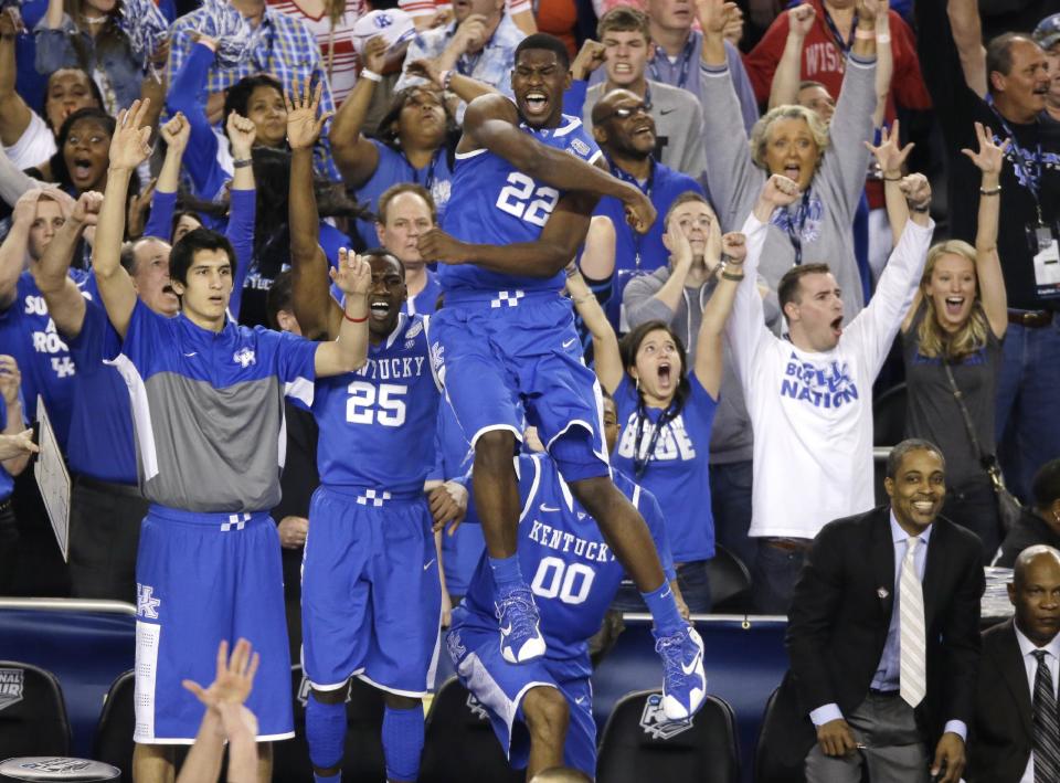 Kentucky forward Alex Poythress (22) reacts after a three-point basket during the second half of an NCAA Final Four tournament college basketball semifinal game against Wisconsin Saturday, April 5, 2014, in Arlington, Texas. Kentucky won 74-73. (AP Photo/Tony Gutierrez)