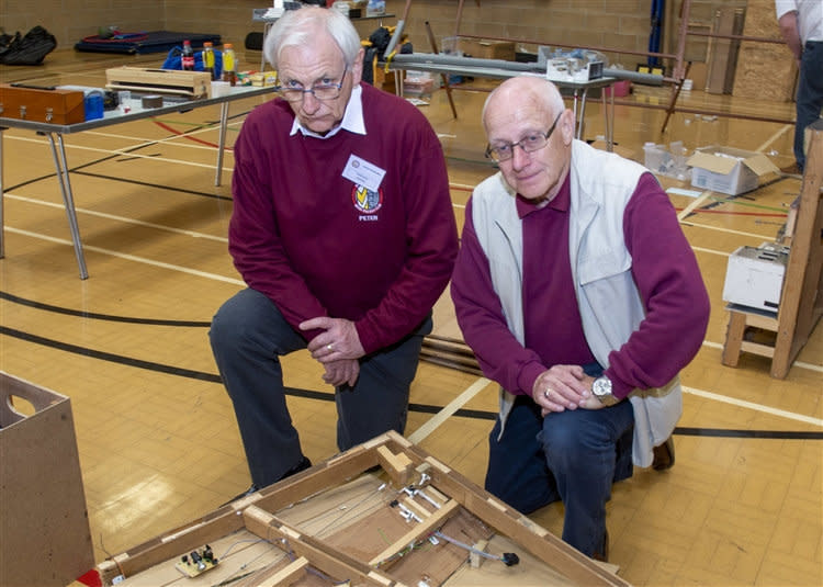 Years of work destroyed: Members of the Market Deeping Model Railway Club after the exhibition was devastated. (SWNS)  