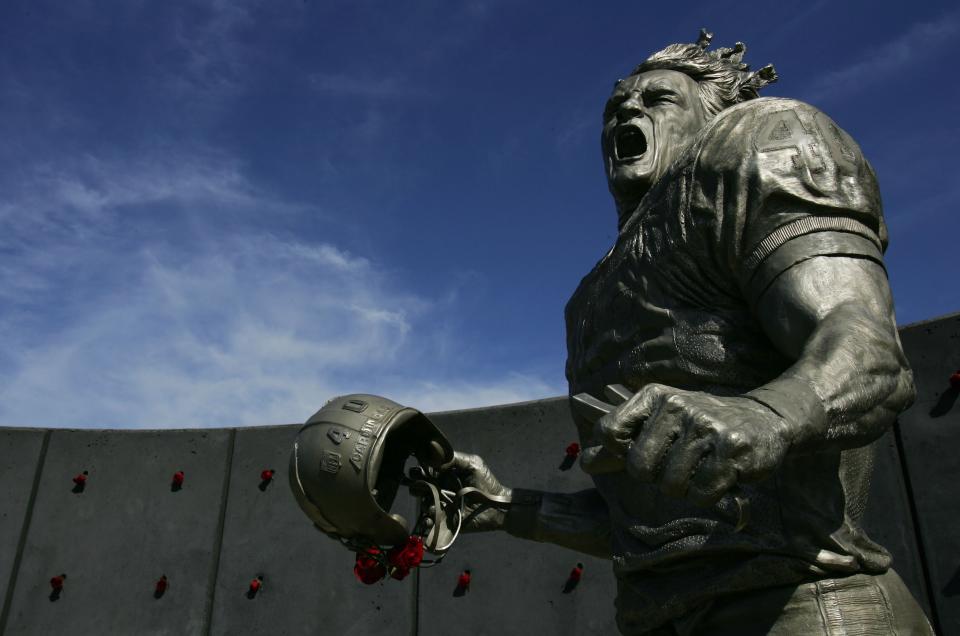 Pat Tillman, who was killed in Afghanistan in 2004 after quitting the NFL's Arizona Cardinals to join the U.S. Army Rangers, was honored with a statue outside the State Farm Stadium before the game between the Arizona Cardinals and the Dallas Cowboys November 12, 2006 in Glendale, Arizona. (Photo by Robert Laberge/Getty Images)