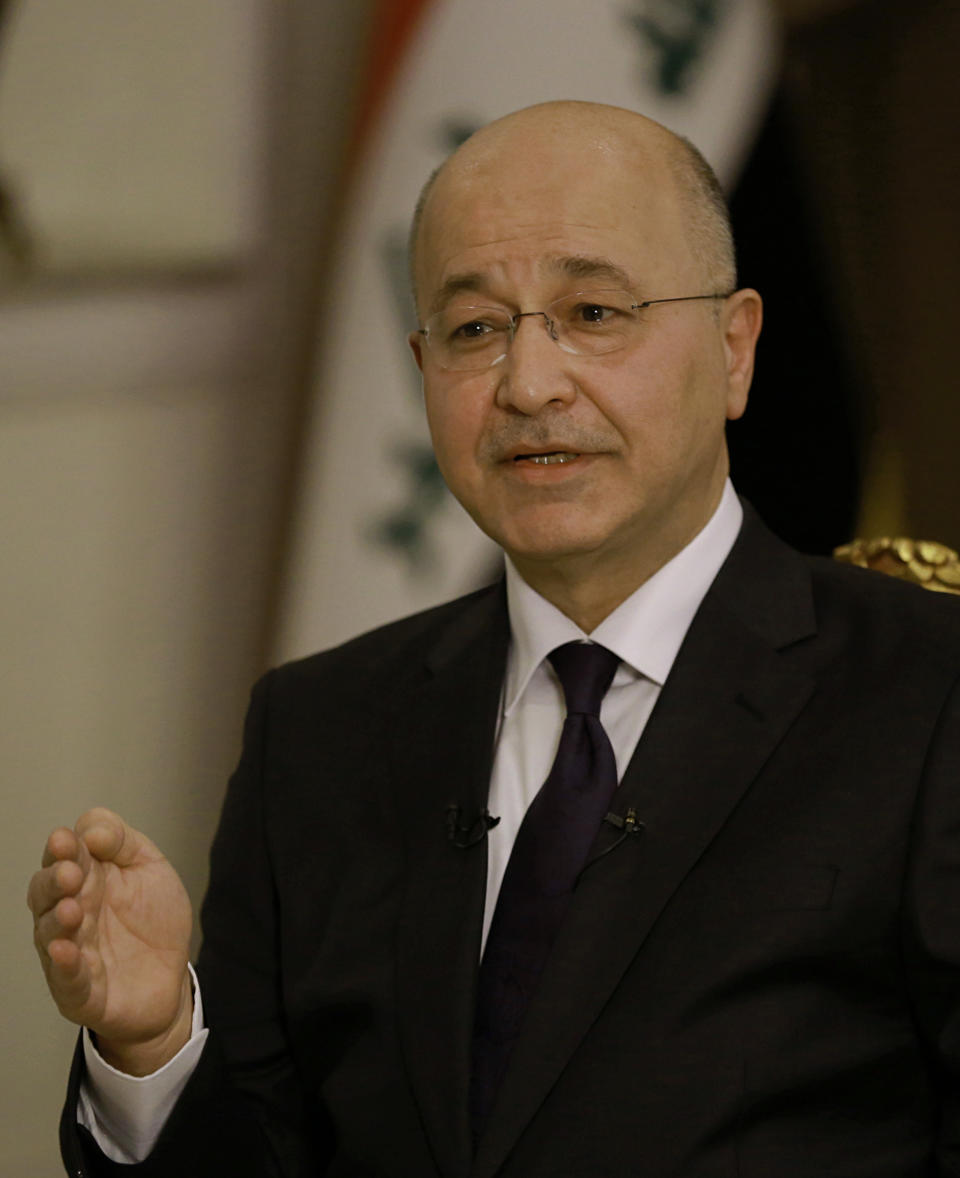 Iraq's President Barham Salih speaks during an interview with The Associated Press in Baghdad, Iraq, Friday, March 29, 2019. Salih says he does not see any "serious" opposition when it comes to the presence of American forces in Iraq as long as they are there for the specific mission of assisting in the fight against the Islamic State group. (AP Photo/Khalid Mohammed)
