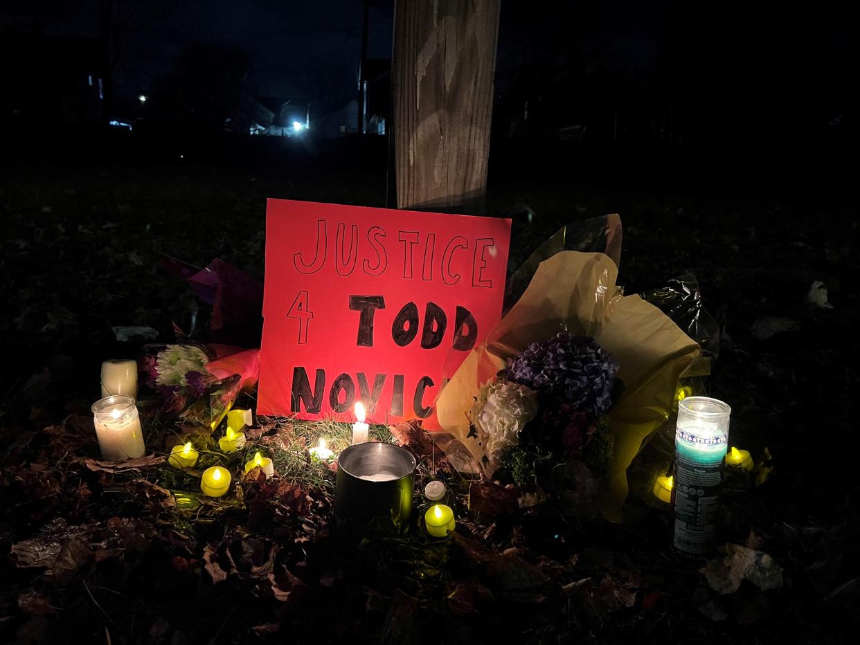 Residents left candles and flowers in an empty yard on Murray Street in Rochester, near where Todd Novick was killed by police on Christmas Eve.