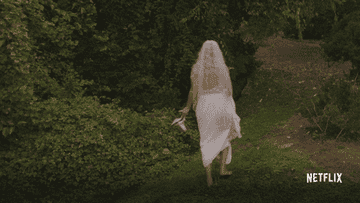 A bride falling in the grass