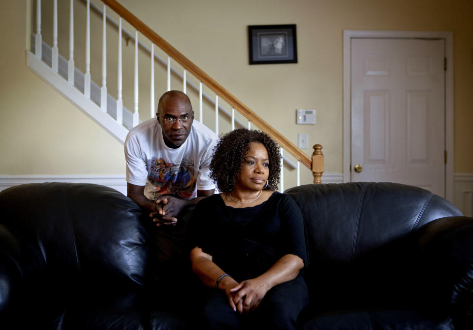 Michael, left, and Patricia Jackson are photographed in their home Saturday, June 16, 2012, in Marietta, Ga. On a suburban cul-de-sac northwest of Atlanta, the Jacksons are struggling to keep a house worth $100,000 less than they owe. Their voices and those of many others tell the story of a country that, for all the economic turmoil of the past few years, continues to believe things will get better. But until it does, families are trying to hang on to what they've got left. The Great Recession claimed nearly 40 percent of Americans' wealth, the Federal Reserve reported last week. The new figures, showing Americans' net worth has plunged back to what it was in 1992, left economists shuddering. (AP Photo/David Goldman)
