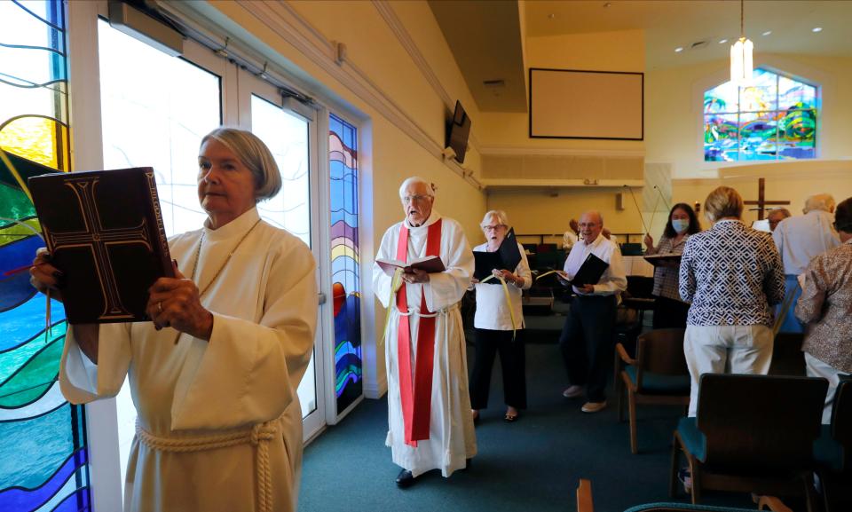 Members of Sanibelâ€™s St. Michael & All Angels Church gather during Palm Sunday on April 2, 2023, at Fort Myers' Peace Lutheran Church. The congregation has had to conduct services at a different location after their Sanibel building was badly damaged by Hurricane Ian last year.