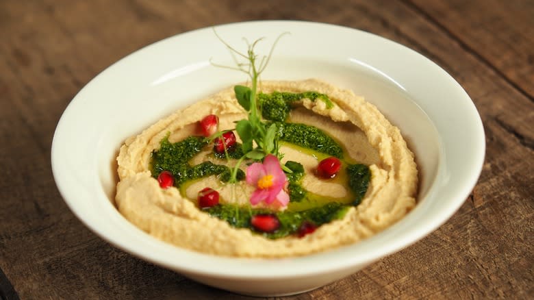 Hummus with pesto and pomegranate